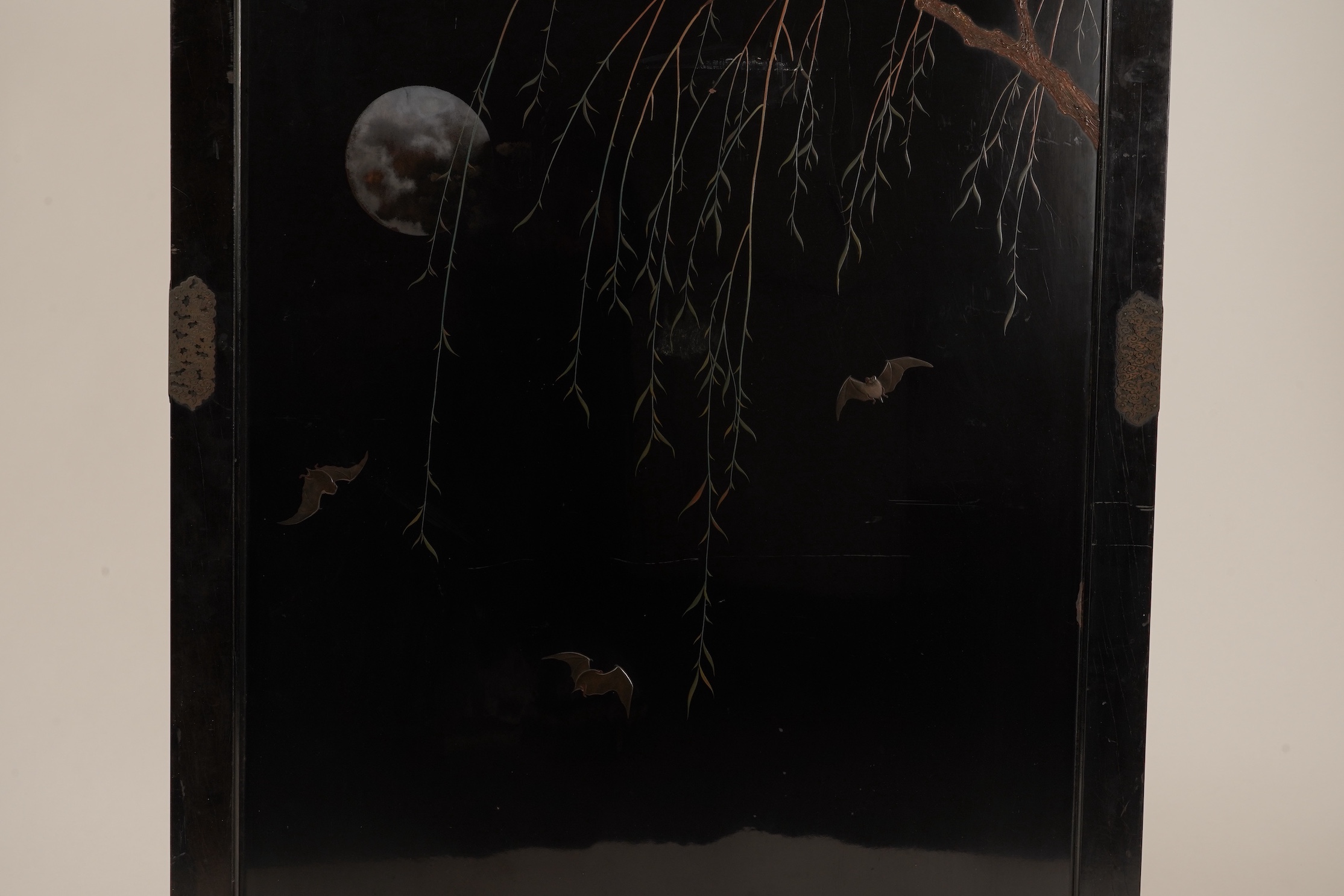 A Japanese inlaid persimmon wood tsuitate screen panel, Meiji period, possibly Tokyo School